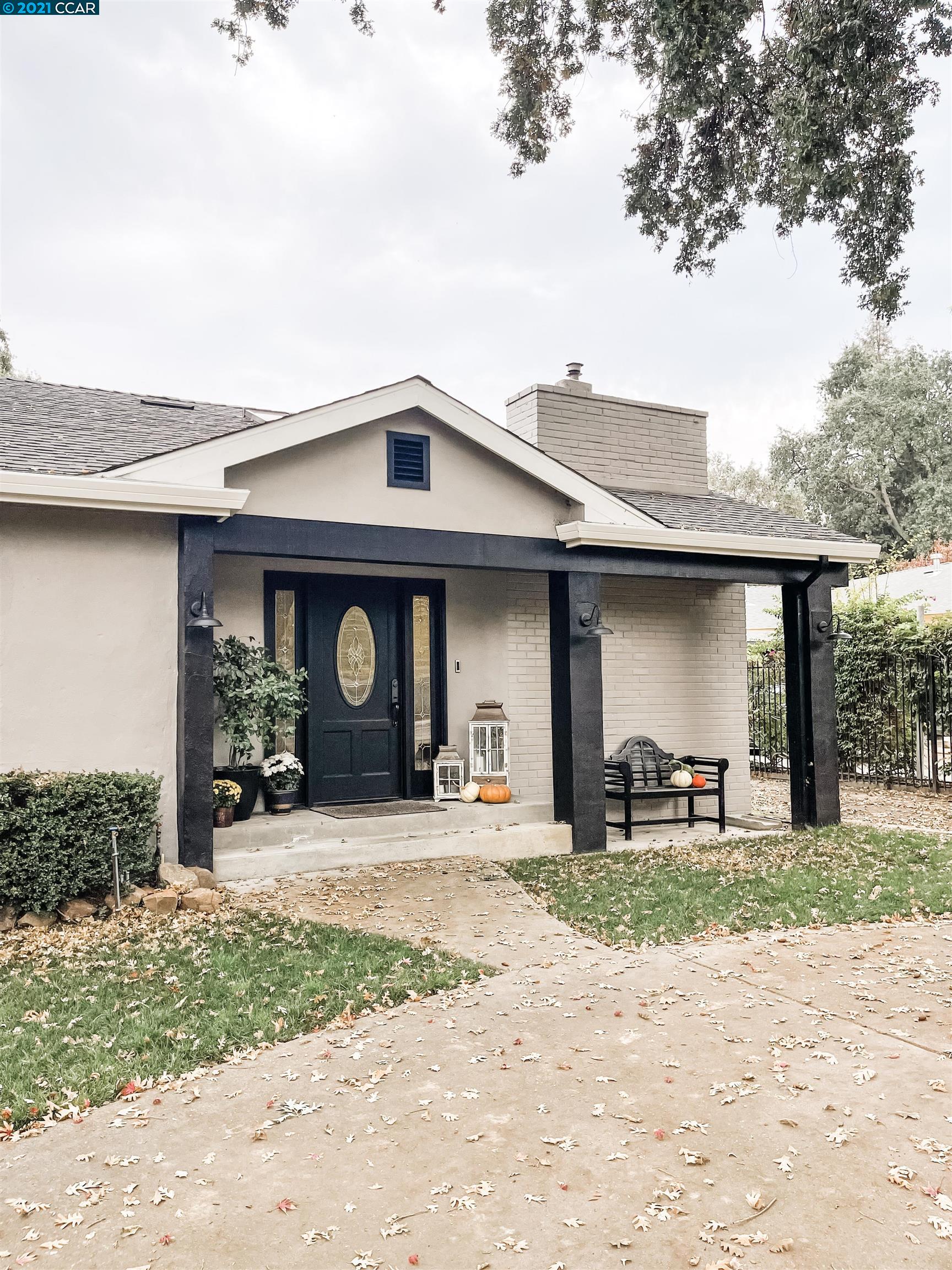 2710 Cherry Lane Walnut Creek, CA 94597 - Photo 1 of 1 a front view of a house with a yard