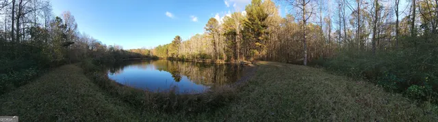 a view of lake with green space