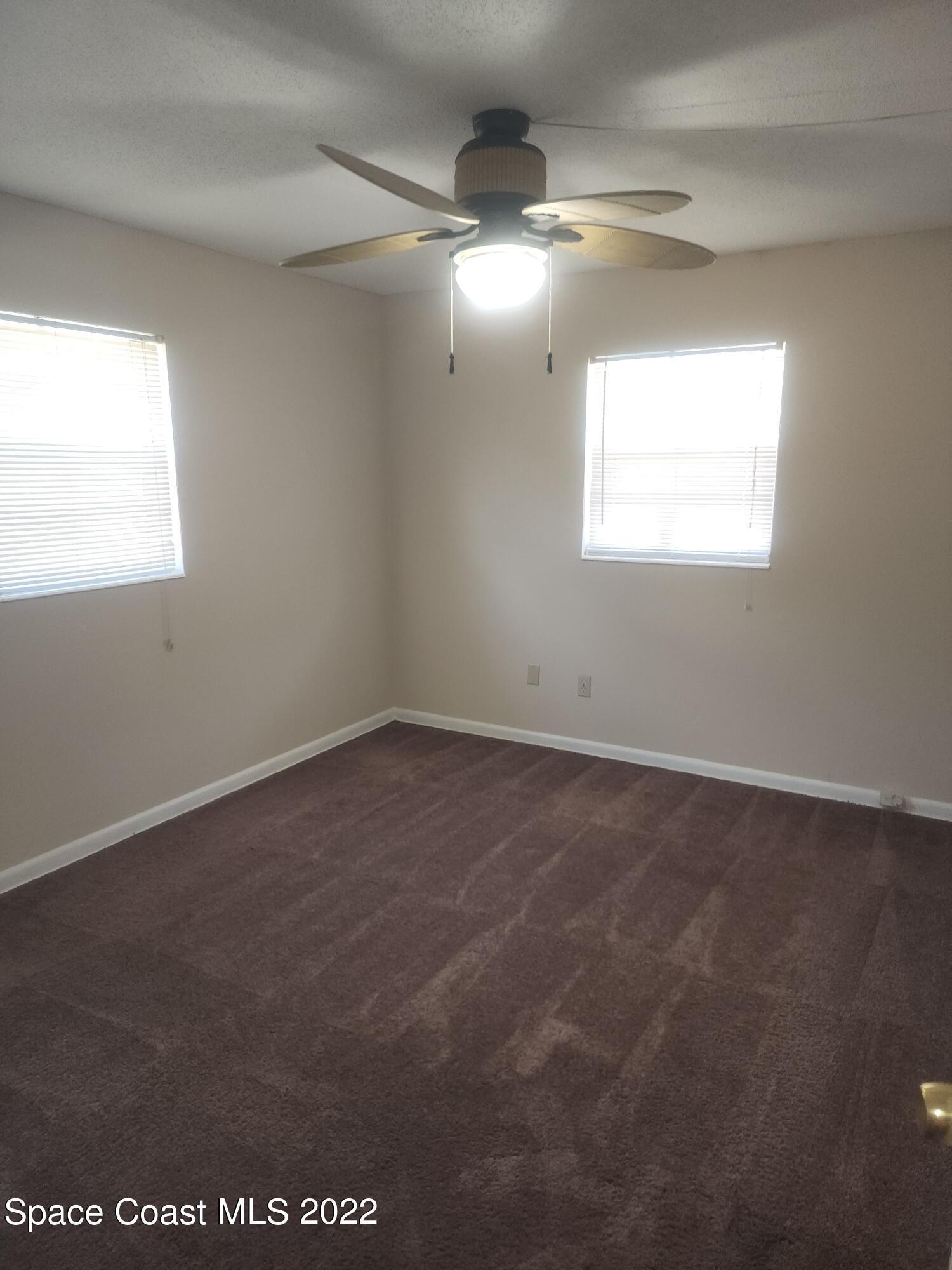 595 Albatross Street Merritt Island, FL 32952 - Photo 21 of 21 an empty room with a window