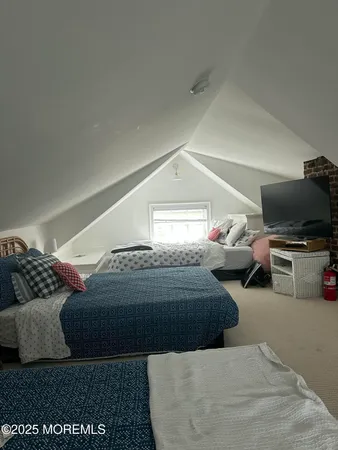 a bed room with a bed and a lamp