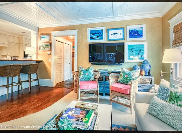 a living room with furniture rug and window