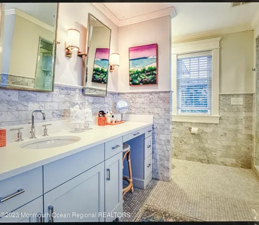 a bedroom with a bed next to a window and a dresser