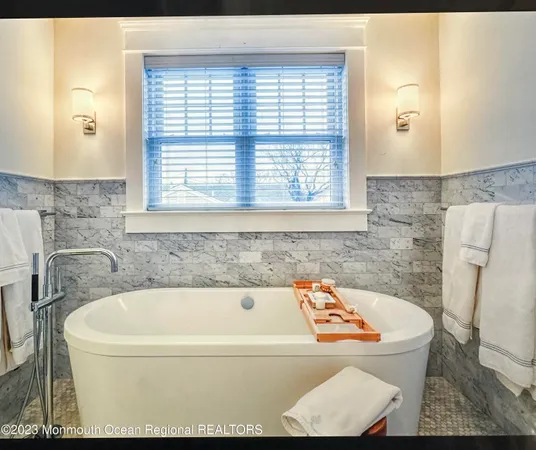 a view of a house with backyard sitting area and garden