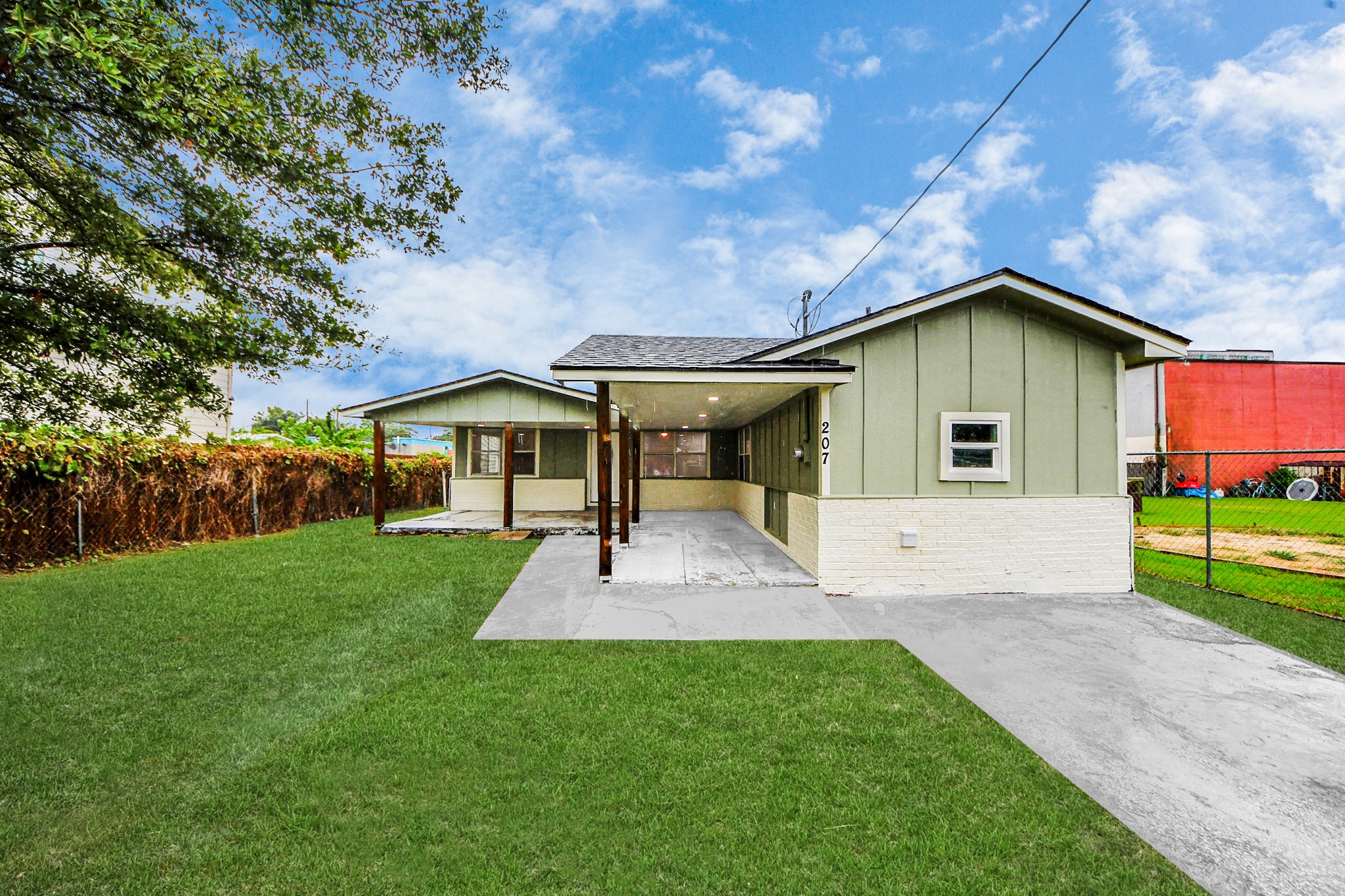 207 East Defee Avenue Baytown, TX 77520 - Photo 1 of 36 a front view of a house with a yard