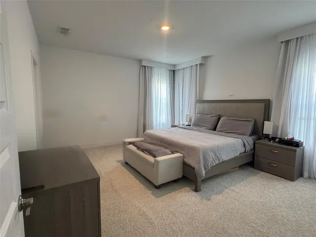 a spacious bathroom with double vanity sink and a mirror