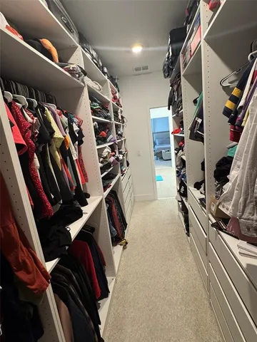 a bathroom with a toilet sink double vanity and mirror