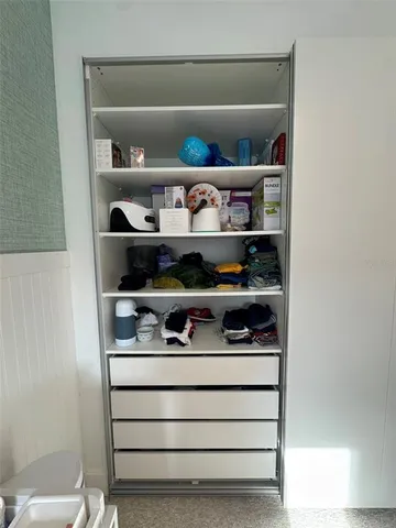 a bed room with furniture and a window