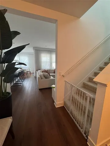 a view of livingroom with furniture and hardwood floor