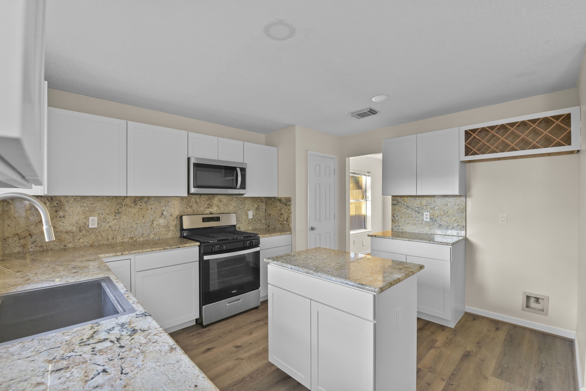 4911 Silver Fox Drive Houston, TX 77066 - Photo 14 of 33 a kitchen with a sink stove and refrigerator