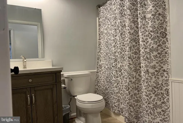 a bathroom with a toilet and a sink
