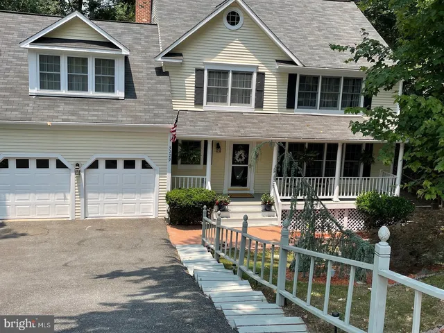 a view of a house with sitting area and garden