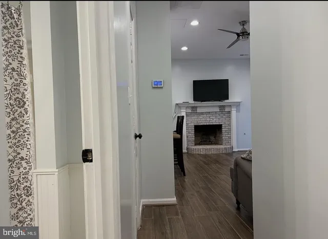 a living room with a flat screen tv and a fireplace