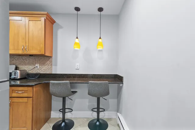 a kitchen with a sink cabinets and window