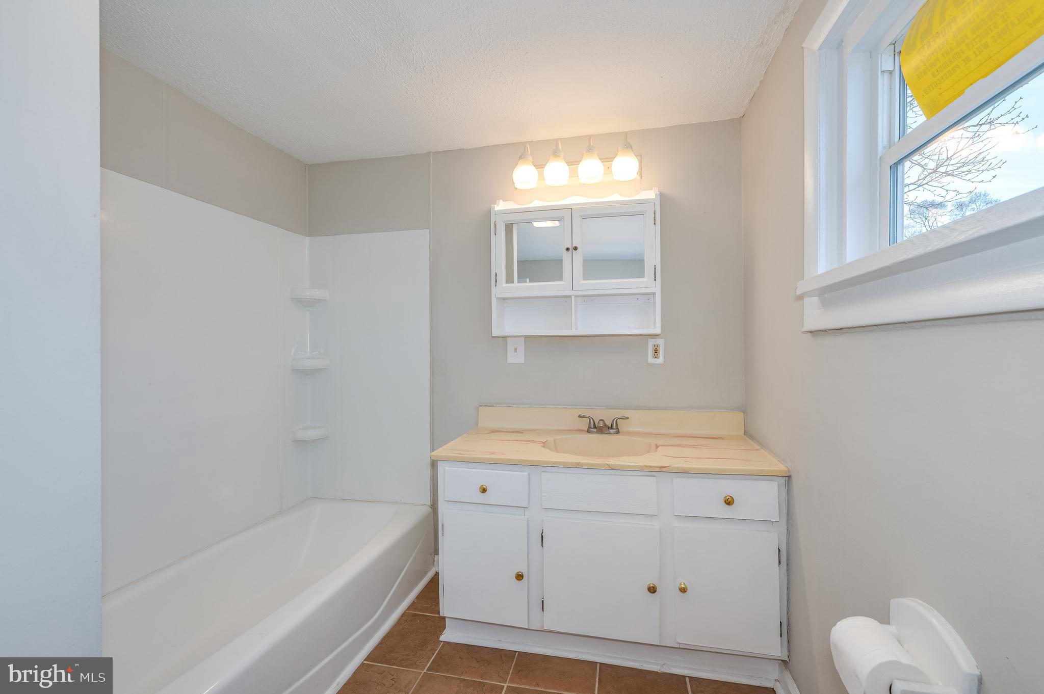 1577 Gerrardstown Road Gerrardstown, WV 25420 - Photo 24 of 47 Ceramic tile floor 4 ft single vanity + tub/shower