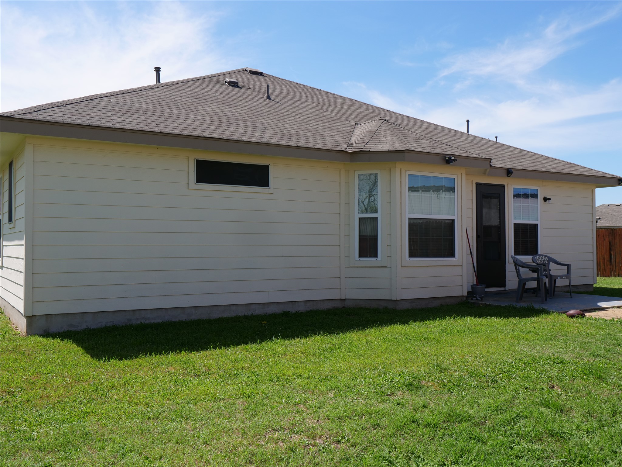 Undisclosed Address Elgin, TX 78621 - Photo 19 of 19 Rear view of property with roof with shingles and a patio