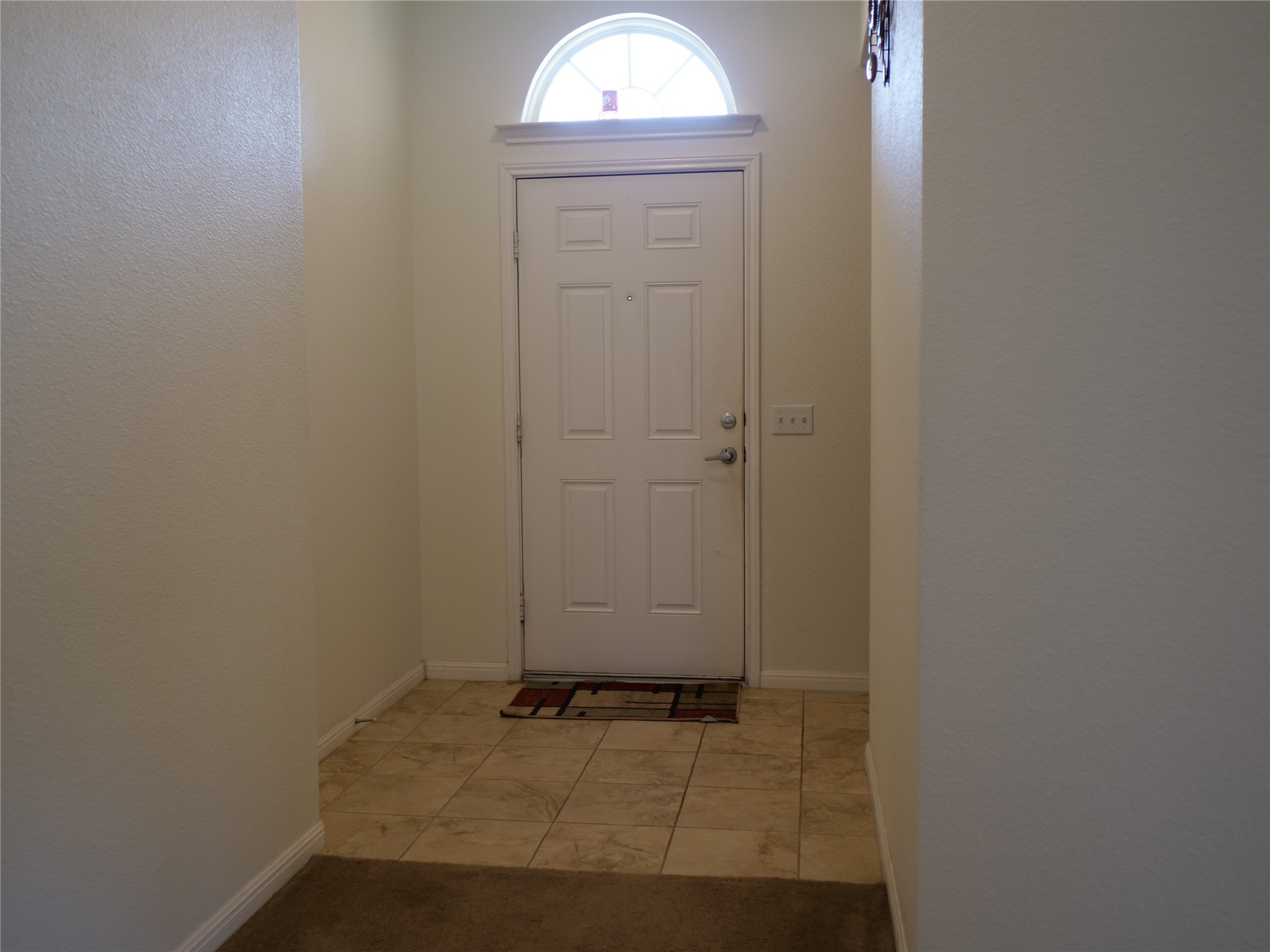 Undisclosed Address Elgin, TX 78621 - Photo 2 of 19 Doorway featuring baseboards and tile patterned flooring