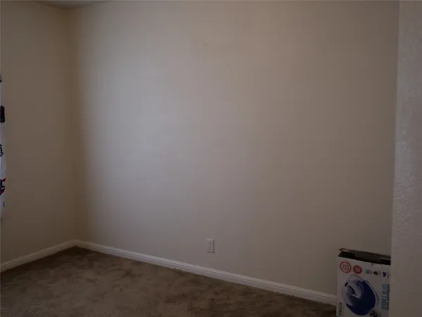 a view of room with windows and flat screen tv