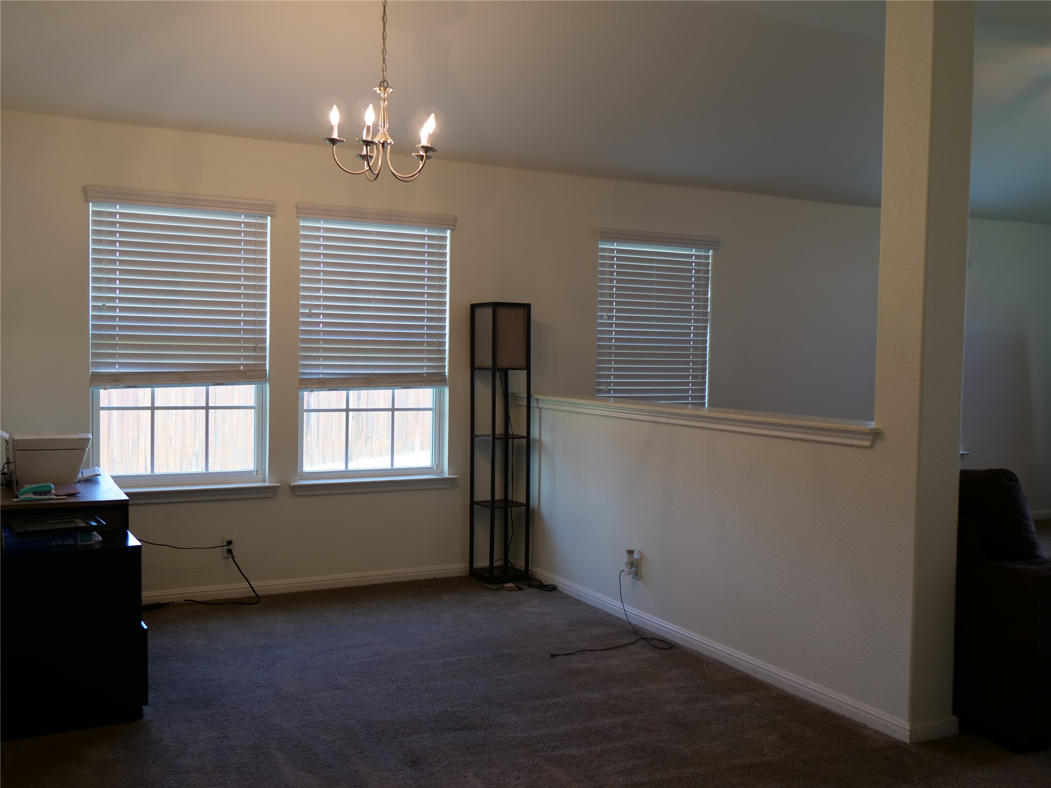 Undisclosed Address Elgin, TX 78621 - Photo 9 of 19 Unfurnished dining area with dark colored carpet and suspended lighting