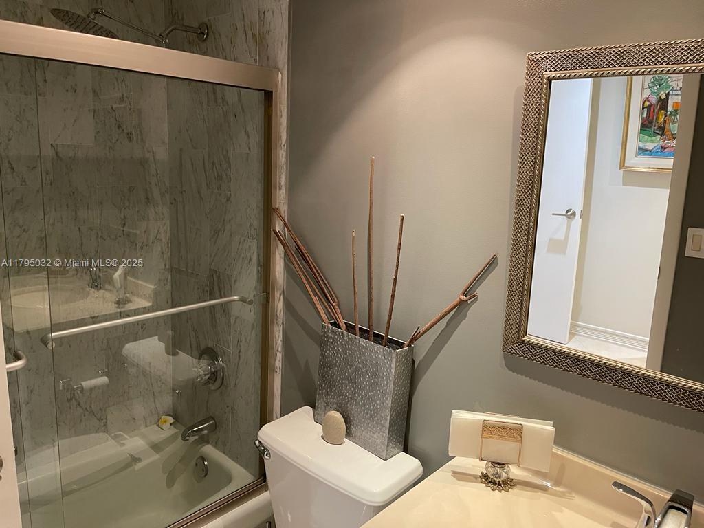 600 Grapetree Drive, Unit 7CS Key Biscayne, FL 33149 - Photo 15 of 19 a bathroom with a sink and a mirror