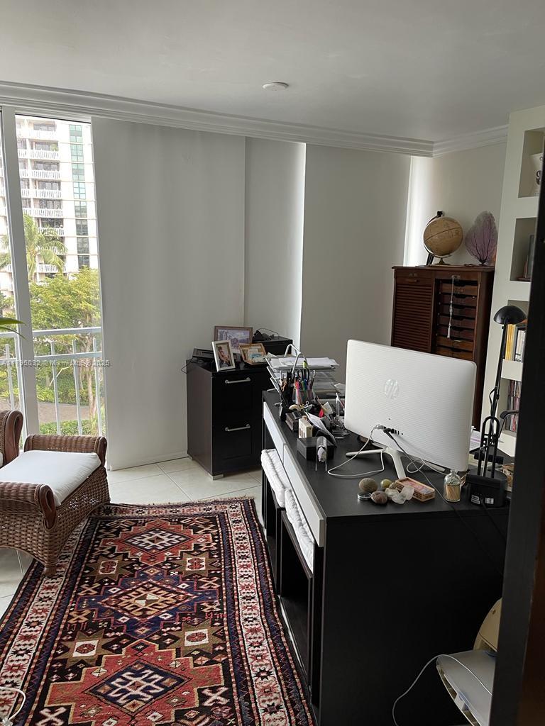 600 Grapetree Drive, Unit 7CS Key Biscayne, FL 33149 - Photo 18 of 19 a bed sitting in a bedroom next to a window