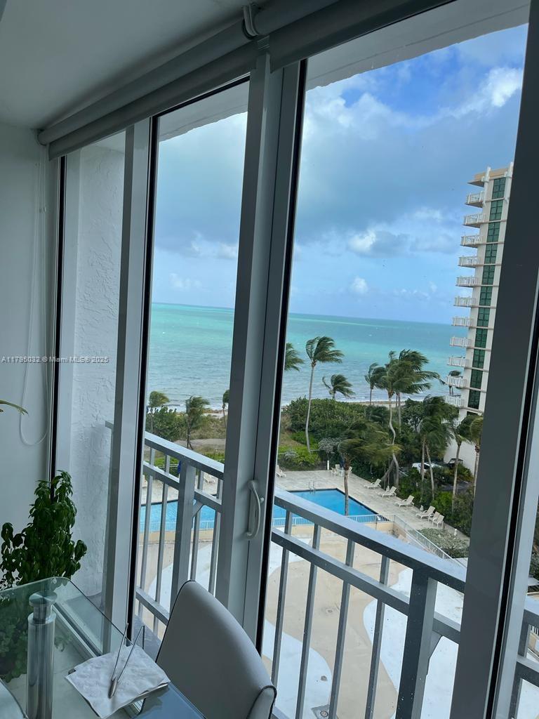 600 Grapetree Drive, Unit 7CS Key Biscayne, FL 33149 - Photo 3 of 19 a view of a balcony with furniture