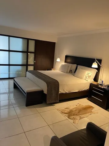 a bedroom with a bed and a cabinets