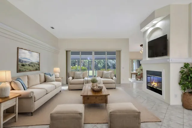 a view of an empty room with a fireplace