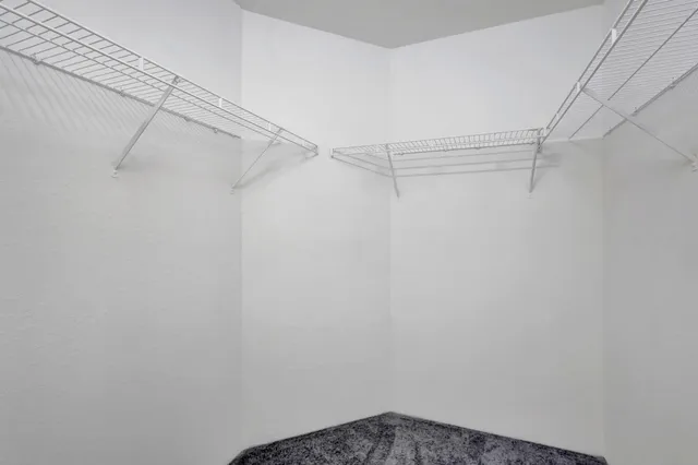 a bathroom with a double vanity sink mirror and bathtub