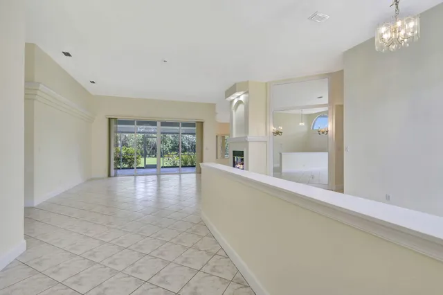 a view of an empty room with windows