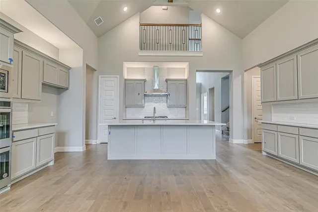 a view of kitchen with refrigerator and window