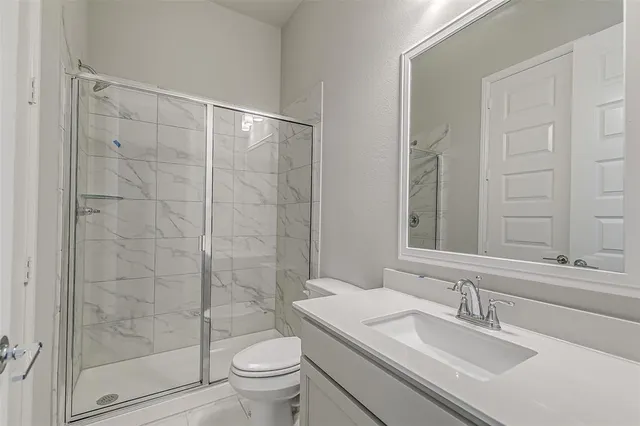 an empty room with a empty space and a ceiling fan