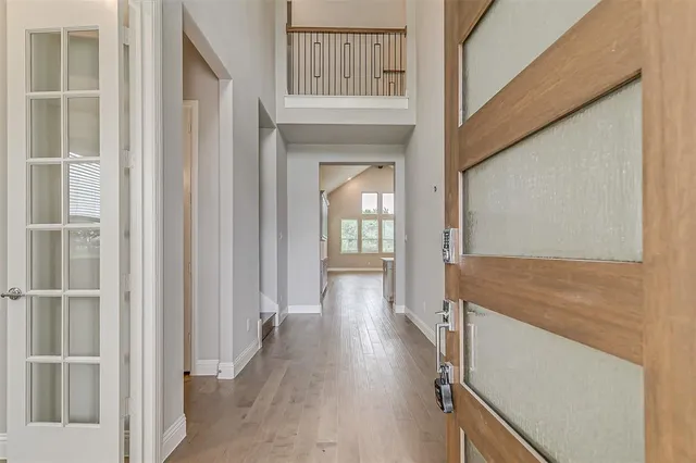 a bathroom with a granite countertop toilet and a sink