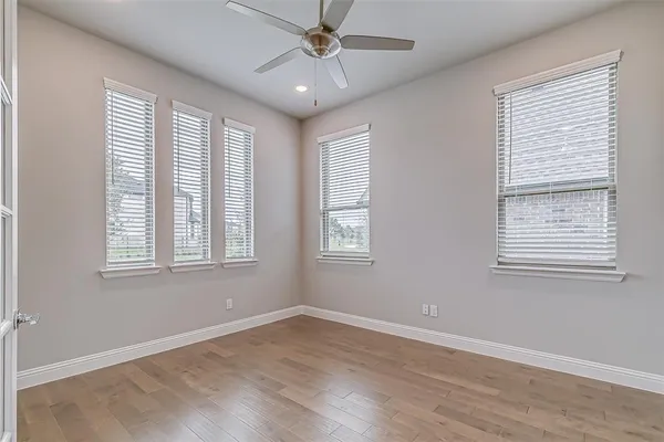 a spacious bathroom with a granite countertop sink and a mirror