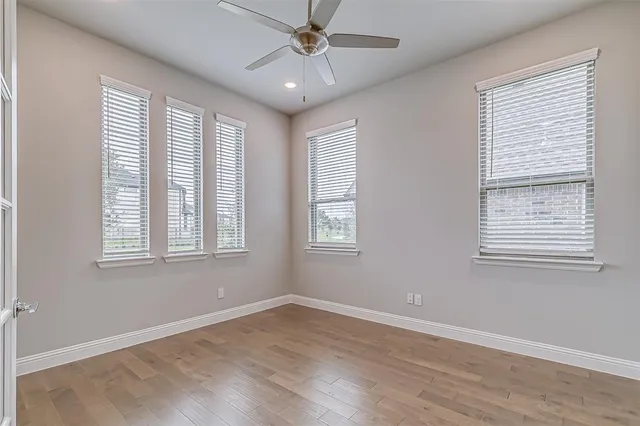 a spacious bathroom with a granite countertop sink and a mirror