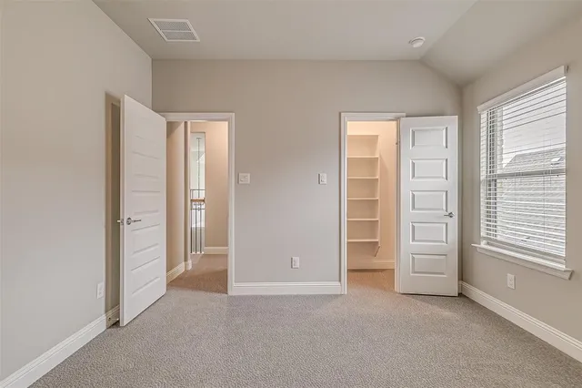 a view of a house with yard and garden