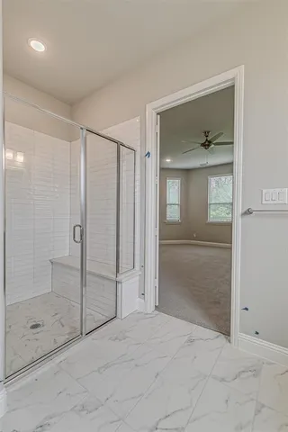 a view of a bathroom from a hallway