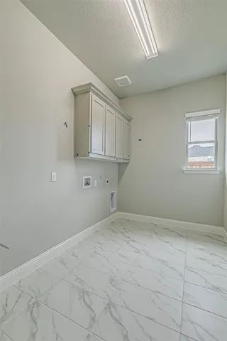 a kitchen with a stove and a sink