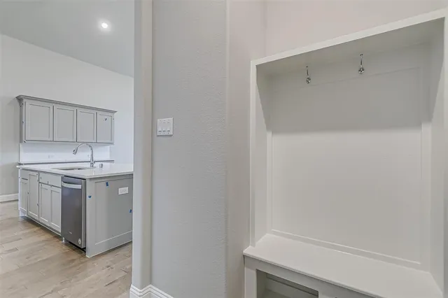 a kitchen with stainless steel appliances granite countertop a sink and cabinets