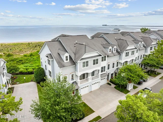 a view of swimming pool with outdoor seating and plants