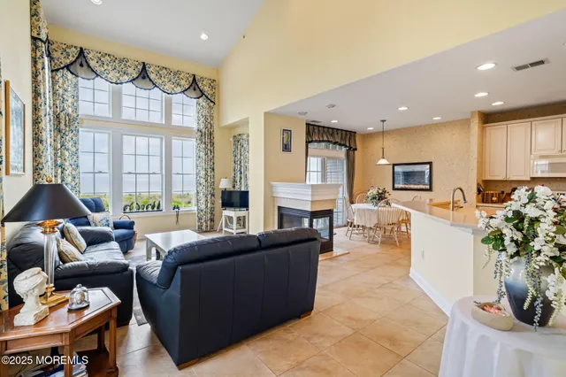 a bathroom with a sink shower and a mirror