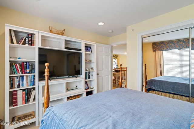 a front view of a house with potted plants