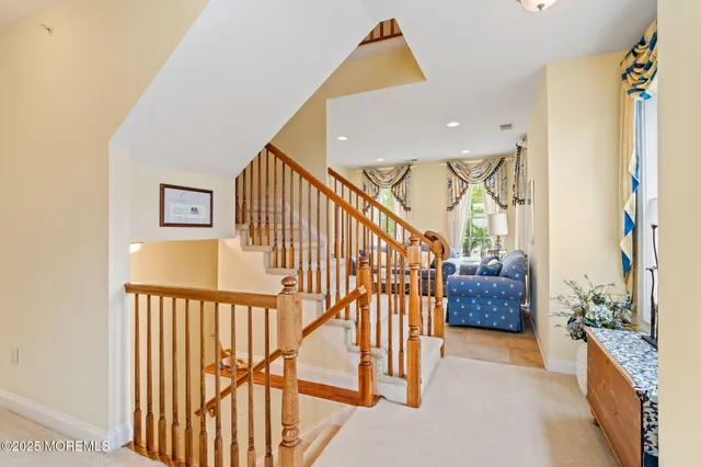 a kitchen with a stove a sink a dining table and chairs