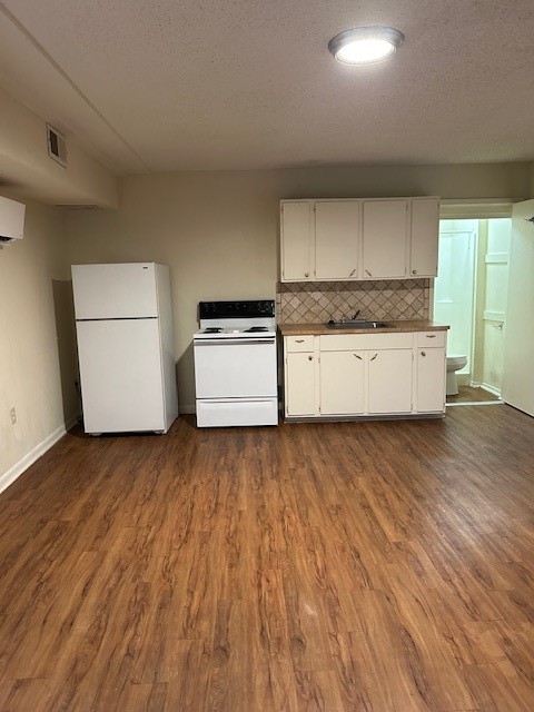 4709 Harmon Avenue, Unit 322 Austin, TX 78751 - Photo 3 of 8 a kitchen with a wooden floor and a sink