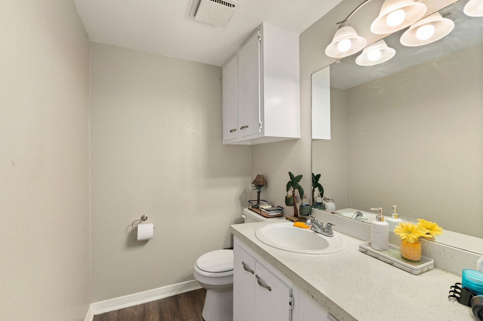 8300 Oakhaven Road La Porte, TX 77571 - Photo 7 of 14 a bathroom with a sink a toilet and a mirror