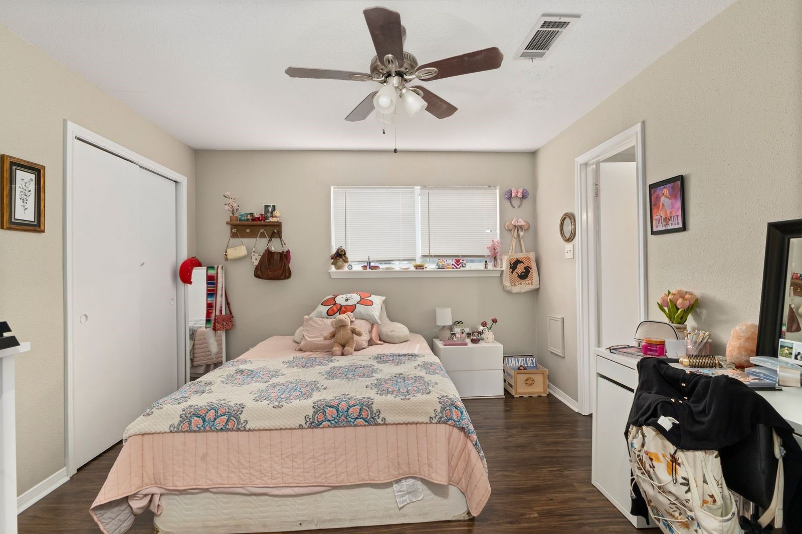 8300 Oakhaven Road La Porte, TX 77571 - Photo 10 of 14 a bedroom with a bed and a chandelier