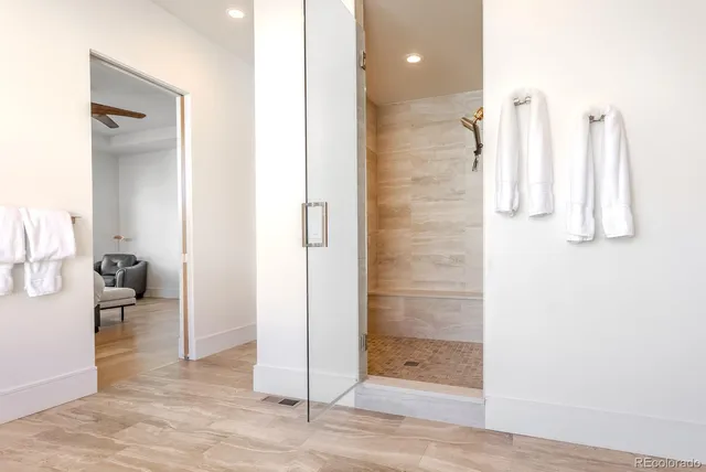 a bathroom with a shower and a sink