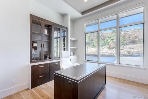 a living room with furniture and large window