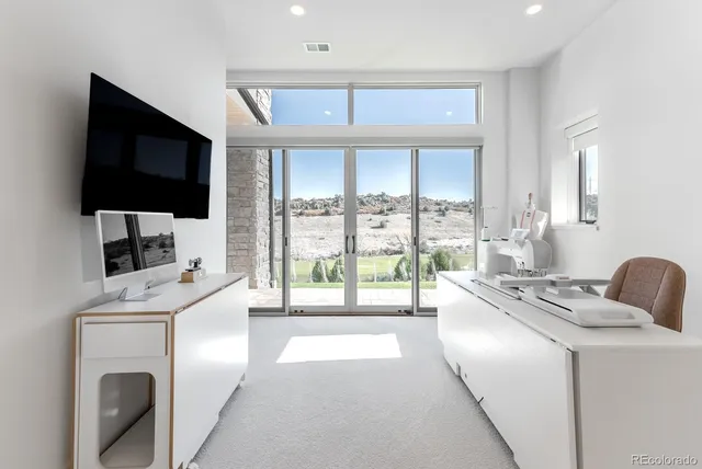 a kitchen that has a microwave a sink and a stove in it
