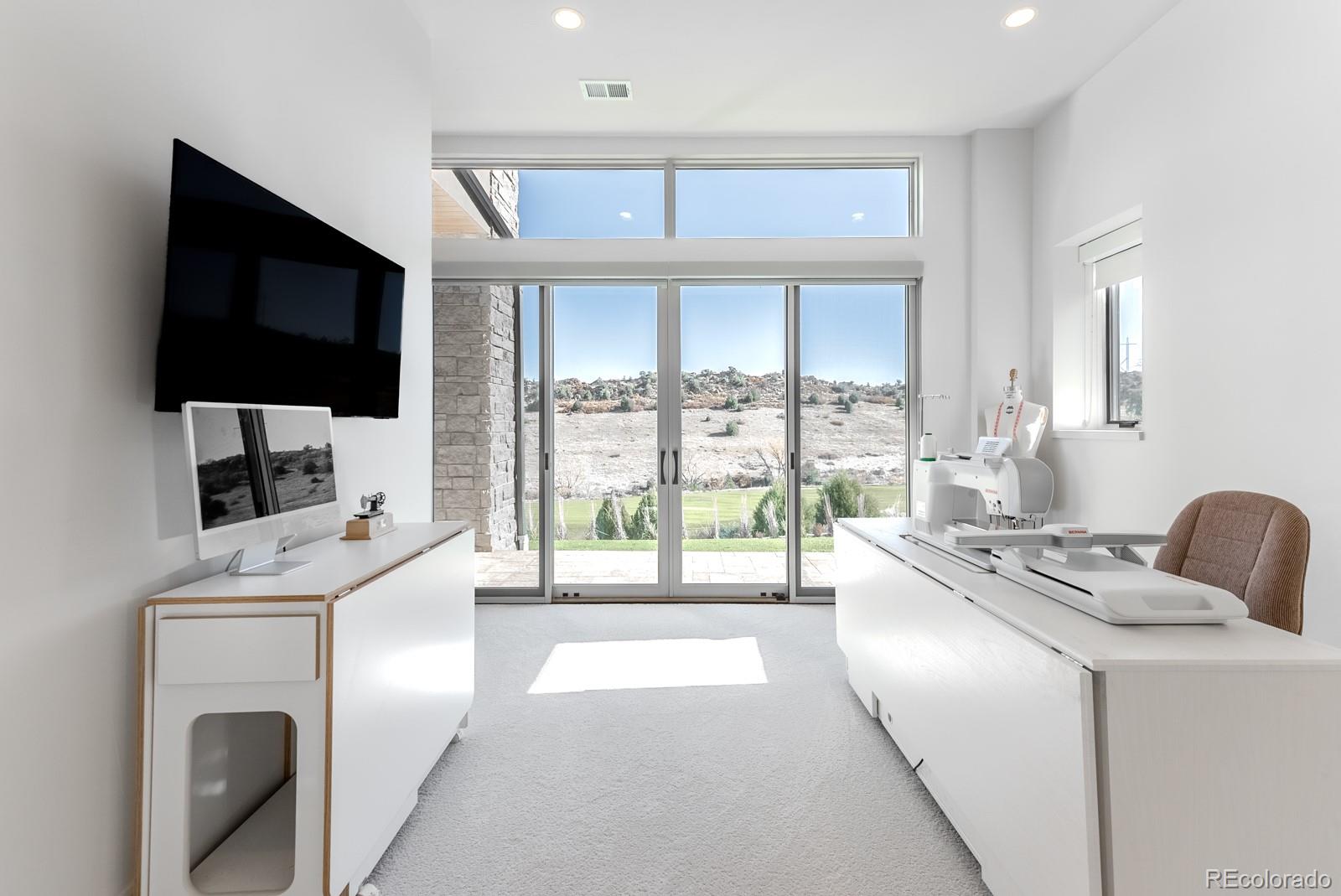 7572 Raphael Lane Littleton, CO 80125 - Photo 39 of 50 a kitchen that has a microwave a sink and a stove in it