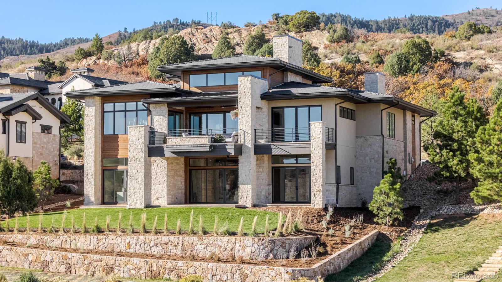 7572 Raphael Lane Littleton, CO 80125 - Photo 43 of 50 a front view of a house with a yard